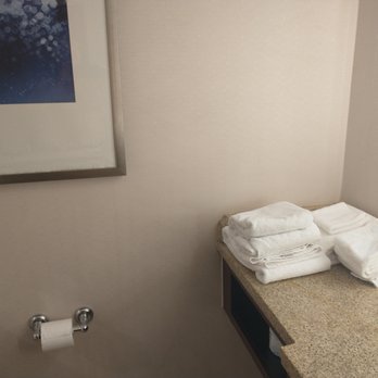 Sheraton Memphis Downtown Hotel - Towels stacked in the corner of the vanity due to no towel racks in the bathroom. - Hotels Near Me - Memphis, Tennessee Sheraton Memphis Downtown Hotel - Towels stacked in the corner of the vanity due to no towel racks in the bathroom. - Hotels Near Me - Memphis, Tennessee