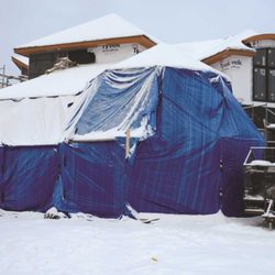 Tarp Supply Inc. - 5mil poly tarp used as a temporary construction cover.