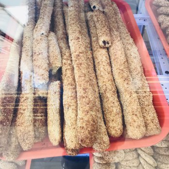 Alhamdani Sweets and Dessert - Sesame sticks filled with dates. - Bakeries Near Me - Spring Valley, California Alhamdani Sweets and Dessert - Sesame sticks filled with dates. - Bakeries Near Me - Spring Valley, California