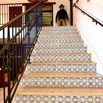 Cattlemen's Bar - Stairs up to the lounge where a replica of John Wayne greets you - Cocktail Bars Near Me - Paso Robles, California