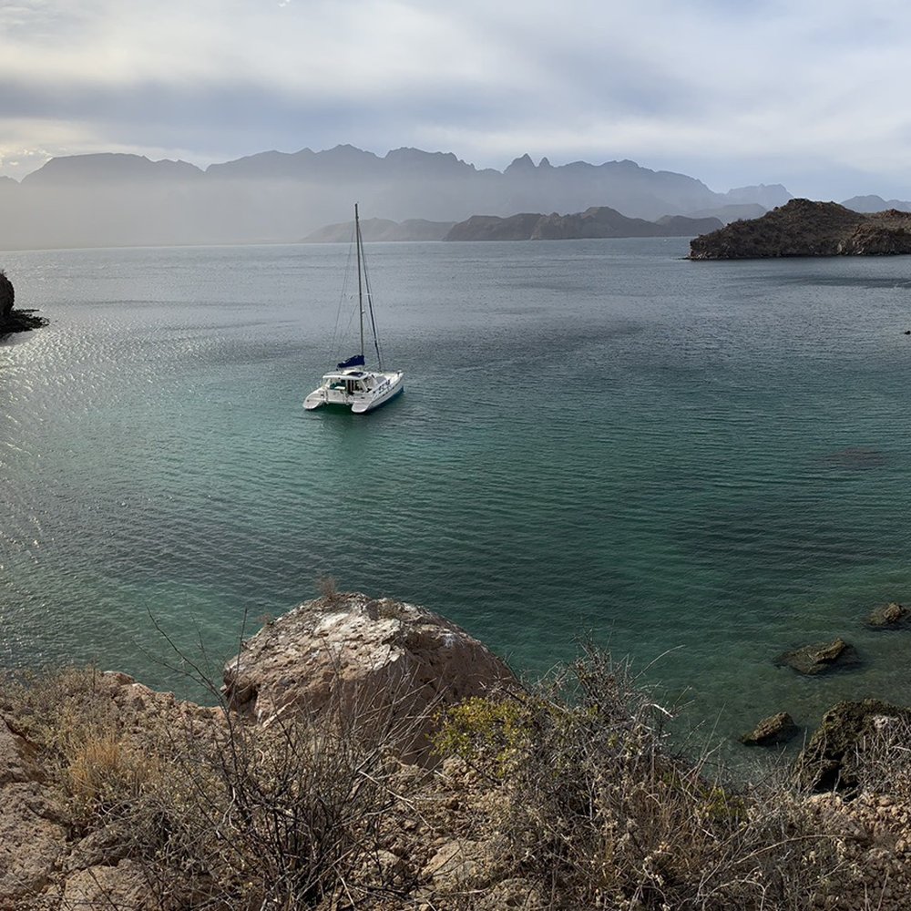 West Coast Multihulls - Our sailing vessel anchored in Honeymoon Bay. You do have time to go for a hike, swim, snorkel, after training. - Boat Charters Near Me - San Diego, California West Coast Multihulls - Our sailing vessel anchored in Honeymoon Bay. You do have time to go for a hike, swim, snorkel, after training. - Boat Charters Near Me - San Diego, California