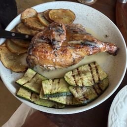 Woodfire grill half chicken with rosemary potatoes and grilled zucchini Woodfire grill half chicken with rosemary potatoes and grilled zucchini