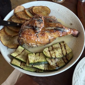 Tucker's Italian - Woodfire grill half chicken with rosemary potatoes and grilled zucchini - Italian Near Me - San Antonio, Texas Tucker's Italian - Woodfire grill half chicken with rosemary potatoes and grilled zucchini - Italian Near Me - San Antonio, Texas