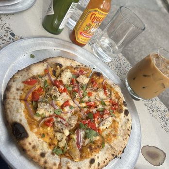 Humble Wood Fire Pizzeria - Curry pizza (add roasted red peppers) and an oat milk latte. - Pizza Near Me - Gainesville, Florida