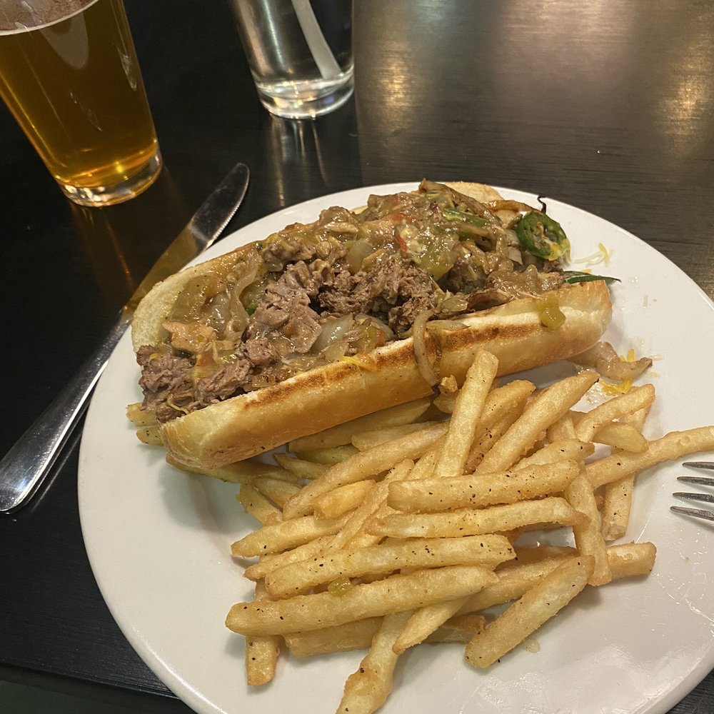 Metropolitan Bar & Grill - Green Chili Philly Cheesesteak - New American Near Me - Englewood, Colorado Metropolitan Bar & Grill - Green Chili Philly Cheesesteak - New American Near Me - Englewood, Colorado