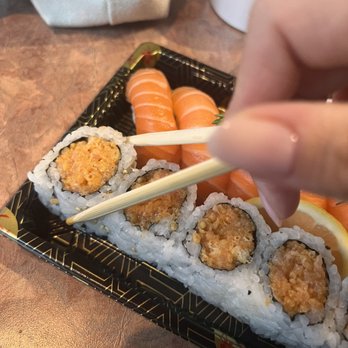 Aya260Sushi - a person holding chopsticks over a sushi - Sushi Bars Near Me - Toronto, Ontario Aya260Sushi - a person holding chopsticks over a sushi - Sushi Bars Near Me - Toronto, Ontario