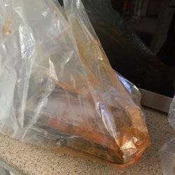 Swiss Chalet Rotisserie & Grill - Wing sauce pooled in bag.