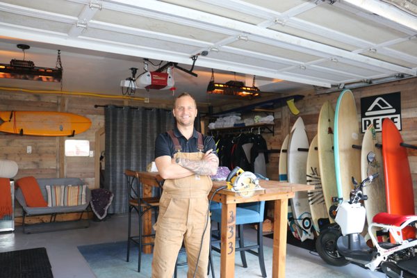 Garage Surf Set Up - This was a complete design and build project. Wood paneling on all walls, epoxy floors, install of sauna, install of deep freezer, custom wetsuit rack, surf rack, w lighting and a custom table. All completed by Evan in 7 days. Garage Surf Set Up - This was a complete design and build project. Wood paneling on all walls, epoxy floors, install of sauna, install of deep freezer, custom wetsuit rack, surf rack, w lighting and a custom table. All completed by Evan in 7 days.