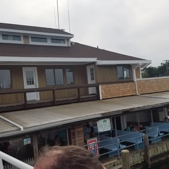 Fire Island Ferries - Back of the departure building. There were blue benches and a bathroom in the waiting area - Ferries Near Me - Ocean Beach, New York Fire Island Ferries - Back of the departure building. There were blue benches and a bathroom in the waiting area - Ferries Near Me - Ocean Beach, New York