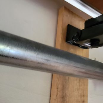 Garage Doors Unlimited - Only a single lag bolt attaches the board to the structure of the wall. - Garage Door Services Near Me - Poway, California Garage Doors Unlimited - Only a single lag bolt attaches the board to the structure of the wall. - Garage Door Services Near Me - Poway, California
