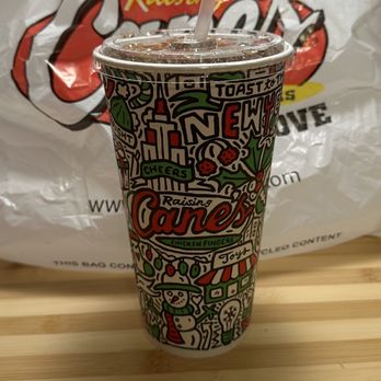 Raising Cane's Chicken Fingers - a paper cup with a straw sticking out of it - Fast Food Near Me - Omaha, Nebraska Raising Cane's Chicken Fingers - a paper cup with a straw sticking out of it - Fast Food Near Me - Omaha, Nebraska