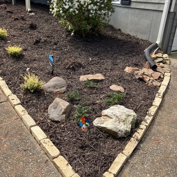 Image Landscape Services - a flower bed with rocks and plants - Landscaping Near Me - Kennesaw, Georgia Image Landscape Services - a flower bed with rocks and plants - Landscaping Near Me - Kennesaw, Georgia