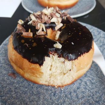 Kneads Bakeshop - Donut dipped in chocolate with shaved curls - Bakeries Near Me - Baltimore, Maryland Kneads Bakeshop - Donut dipped in chocolate with shaved curls - Bakeries Near Me - Baltimore, Maryland