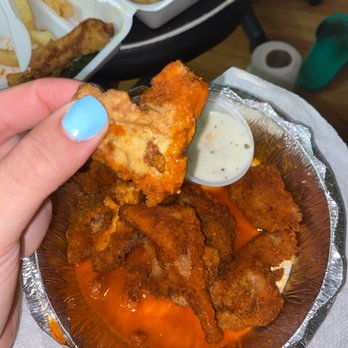Land & Sea Restaurant - a hand holding a piece of fried chicken - Diners Near Me - Fair Lawn, New Jersey Land & Sea Restaurant - a hand holding a piece of fried chicken - Diners Near Me - Fair Lawn, New Jersey