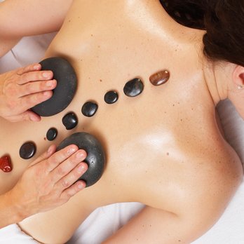 The Holistic Spa - Involves the use of smooth, heated stones that are places on your body to relieve tense, sore muscles. - Massage Therapy Near Me - Gaylord, Michigan The Holistic Spa - Involves the use of smooth, heated stones that are places on your body to relieve tense, sore muscles. - Massage Therapy Near Me - Gaylord, Michigan