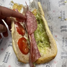 a sandwich with meat and vegetables a sandwich with meat and vegetables
