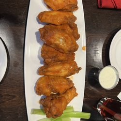 Burger Bar - Buffalo wings. They looked better than they tasted. Tough, like they were microwaved. Hamburger too . Toppings were good for the burger.