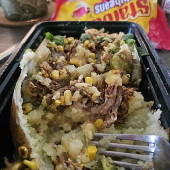 House of Spudz - My potato with garlic buterr, barbacoa, elote, jalapeños, onion stings and green onion with queso. - Popcorn Shops Near Me - Canton, Ohio House of Spudz - My potato with garlic buterr, barbacoa, elote, jalapeños, onion stings and green onion with queso. - Popcorn Shops Near Me - Canton, Ohio