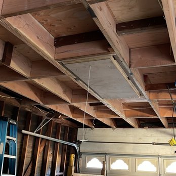 Pro Ready Construction - a man working on the ceiling - General Contractors Near Me Pro Ready Construction - a man working on the ceiling - General Contractors Near Me