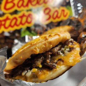 The Loaded Baked Potato Bar - Toasted flatbread steak and cheese sandwiches- - Soul Food Near Me - Rochester, Minnesota The Loaded Baked Potato Bar - Toasted flatbread steak and cheese sandwiches- - Soul Food Near Me - Rochester, Minnesota