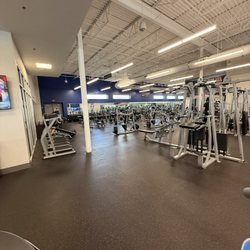 Back room area with free weights and machines