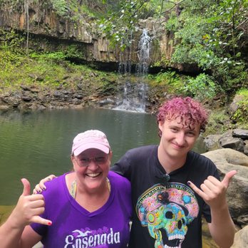 Hike Maui - My son and I at the second waterfall. He jumped off the cliff to the right of the falls. - Tours Near Me - Kahului, Hawaii Hike Maui - My son and I at the second waterfall. He jumped off the cliff to the right of the falls. - Tours Near Me - Kahului, Hawaii