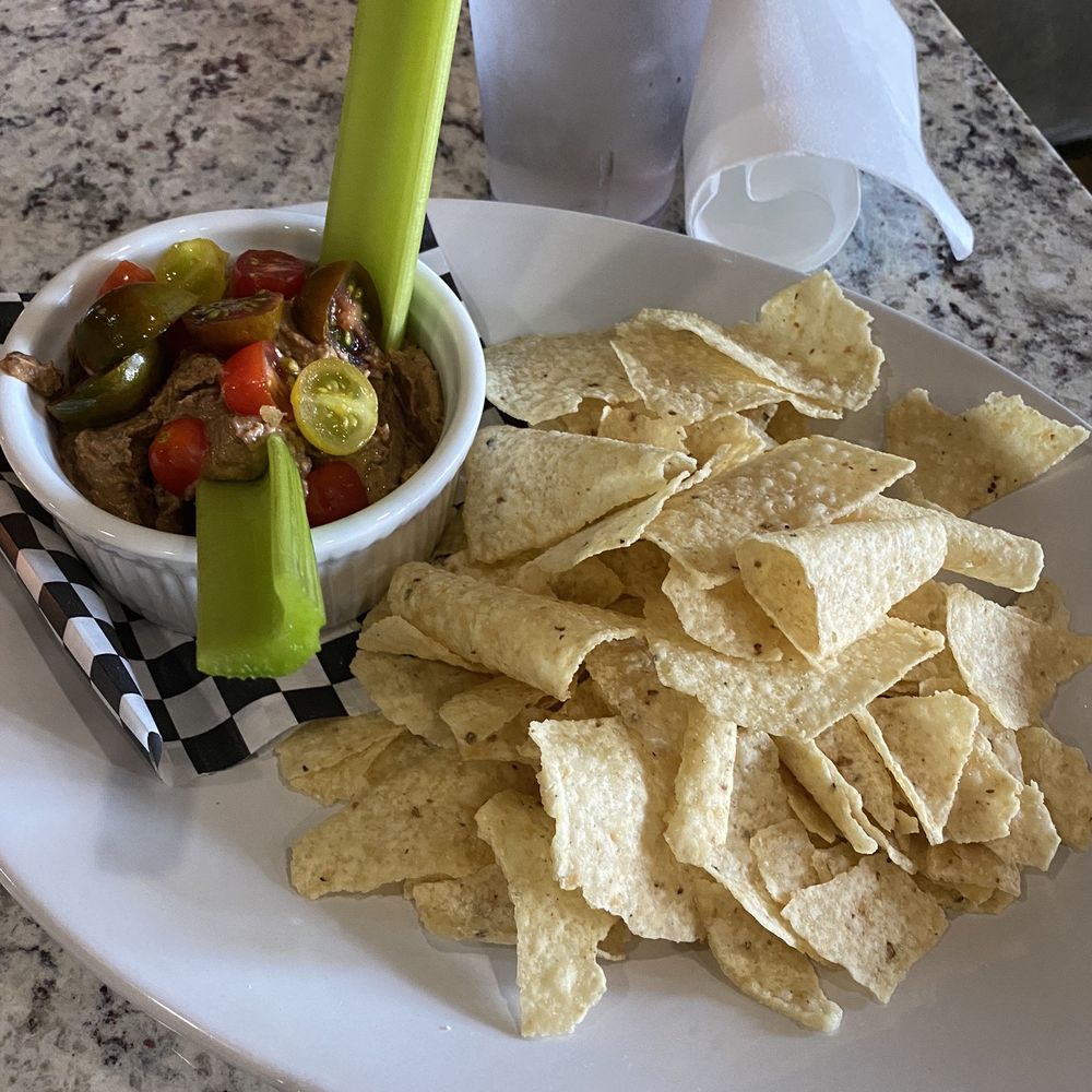 The Buzzard's Roost Bar & Inn - Bagged tortilla chips and black bean hummus. - Bed & Breakfast Near Me - Laurel, Mississippi The Buzzard's Roost Bar & Inn - Bagged tortilla chips and black bean hummus. - Bed & Breakfast Near Me - Laurel, Mississippi