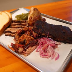 Brother John's Beer Bourbon & BBQ - From the Smoker - Family Style: Brisket, Half Chicken, St. Louis Ribs, Pulled Pork, Pickled Onion & Jalapeño, Texas Toast.