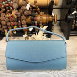 Dinner, drinks, and a bag that steals the show. Handwoven Thai silk purse -- fits your phone, looks like a million bucks.