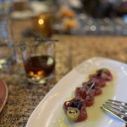 How to Cook a Wolf - Ahi Crudo next to the The Professor (with the toasted rosemary)