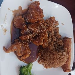 Chang's Gourmet - Sesame chicken with friend rice and an egg roll.