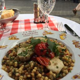 Risotto pasta with artichokes, tomatoes, pesto