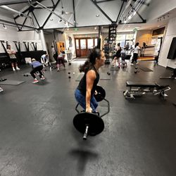 The T.A.N.K. Fitness System - Weighted-squat jumps to elevate the heart rate for maximum calorie burn.