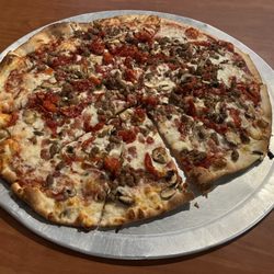 Pizza Castle - Pizza Castle. Our 16" pizza with four ingredients, bacon, sun dried tomatos, meatballs and mushrooms.