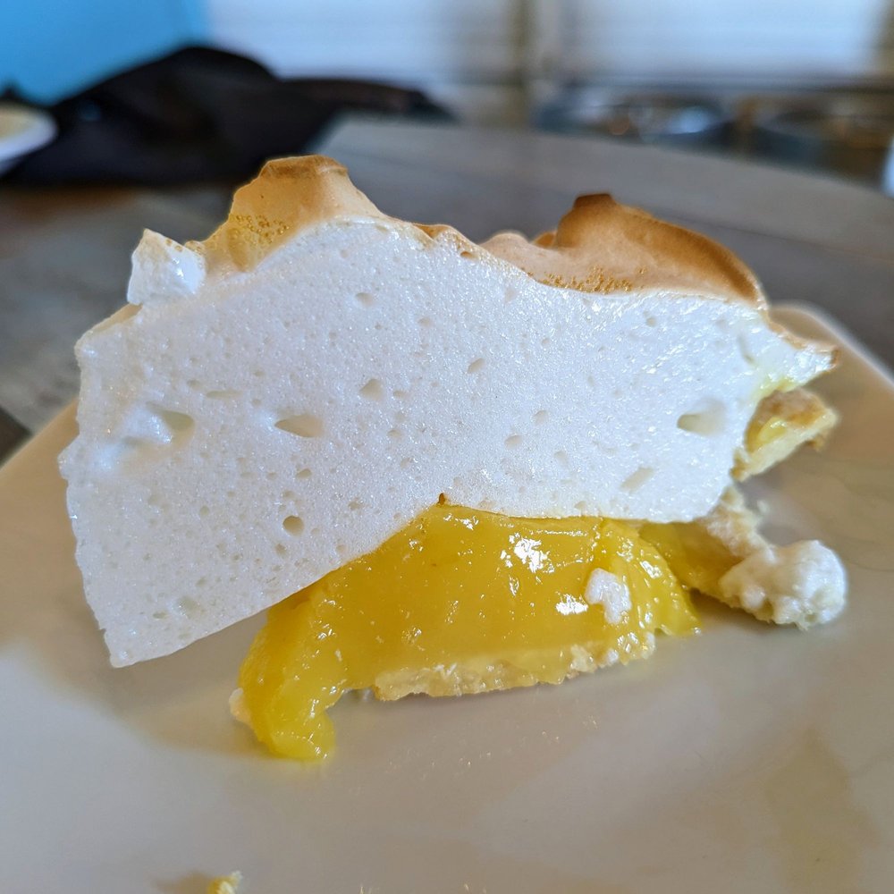 The Kosmos - Lemon meringue pie was pretty delicious, even while it looked lopsided in proportions. - Bars Near Me - Albuquerque, New Mexico