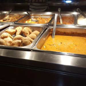 Photo of Rajun Cajun - Chicago, IL, United States. Samosas and other assorted food