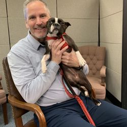 Law Offices of John W. Callinan - John with client's puppy