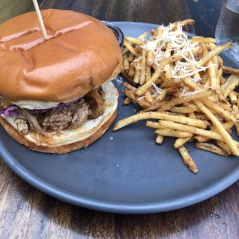 Flying Pig Pub & Kitchen - Pulled pork sandwich with fries - Pubs Near Me - Oceanside, California Flying Pig Pub & Kitchen - Pulled pork sandwich with fries - Pubs Near Me - Oceanside, California