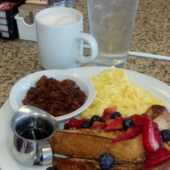 Perk Eatery - Fresh berries French toast combo, with soft-scrambled eggs and spicy chorizo, and a cappuccino. - Diners Near Me - Scottsdale, Arizona