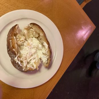 Texas Roadhouse - Sad baked potato served to my wife. - Steakhouses Near Me - Johnston, Iowa
