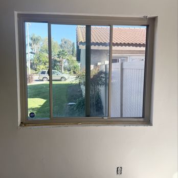 Blue Bridge Painting - BEFORE: dining room window without casing - Painters Near Me Blue Bridge Painting - BEFORE: dining room window without casing - Painters Near Me
