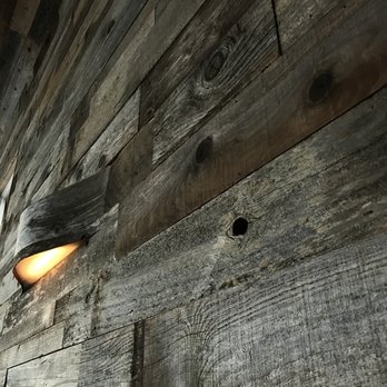 Outerlands - Neat wood walls with light fixtures. - New American Near Me - San Francisco, California