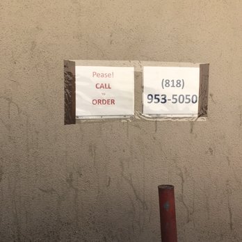 Norm's Hamburger - two signs on a wall - Burgers Near Me - Burbank, California
