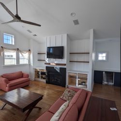 Ace Handyman Services Outer Banks - Updated fireplace and LR with new fans, lighting, board and batten, floating shelves and mantel.