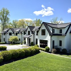 ZD Stucco Repair - Completed whole-house stucco restoration with a modern white-and-black exterior in Tenafly.