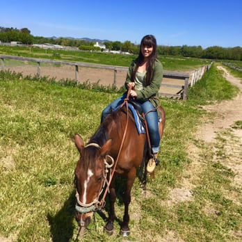 Pacific Dunes Riding Ranch - Her horse stopped for lunch - Horseback Riding Near Me - Oceano, California Pacific Dunes Riding Ranch - Her horse stopped for lunch - Horseback Riding Near Me - Oceano, California