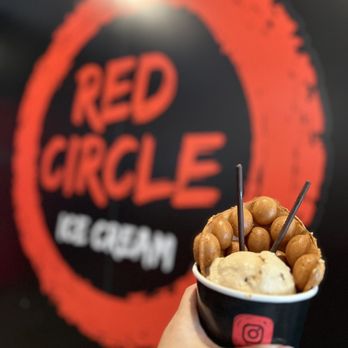 Red Circle Ice Cream - Pearland - a hand holding a cup of ice cream - Desserts Near Me - Pearland, Texas