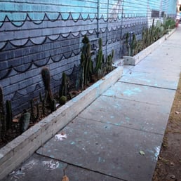 This was once a wall with a lovely look then the art store moved in. Look at what they did to the sidewalk, ugly! This was once a wall with a lovely look then the art store moved in. Look at what they did to the sidewalk, ugly!