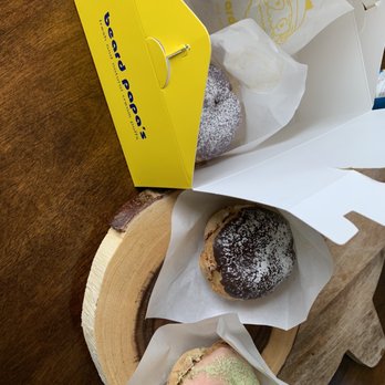 Beard Papa's - a box of doughnuts on a table - Desserts Near Me - Flushing, New York