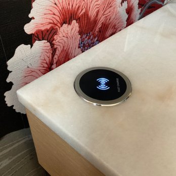 Versante Hotel - Bedside tables feature wireless chargers as well as USB ports - Hotels Near Me - Richmond, British Columbia Versante Hotel - Bedside tables feature wireless chargers as well as USB ports - Hotels Near Me - Richmond, British Columbia